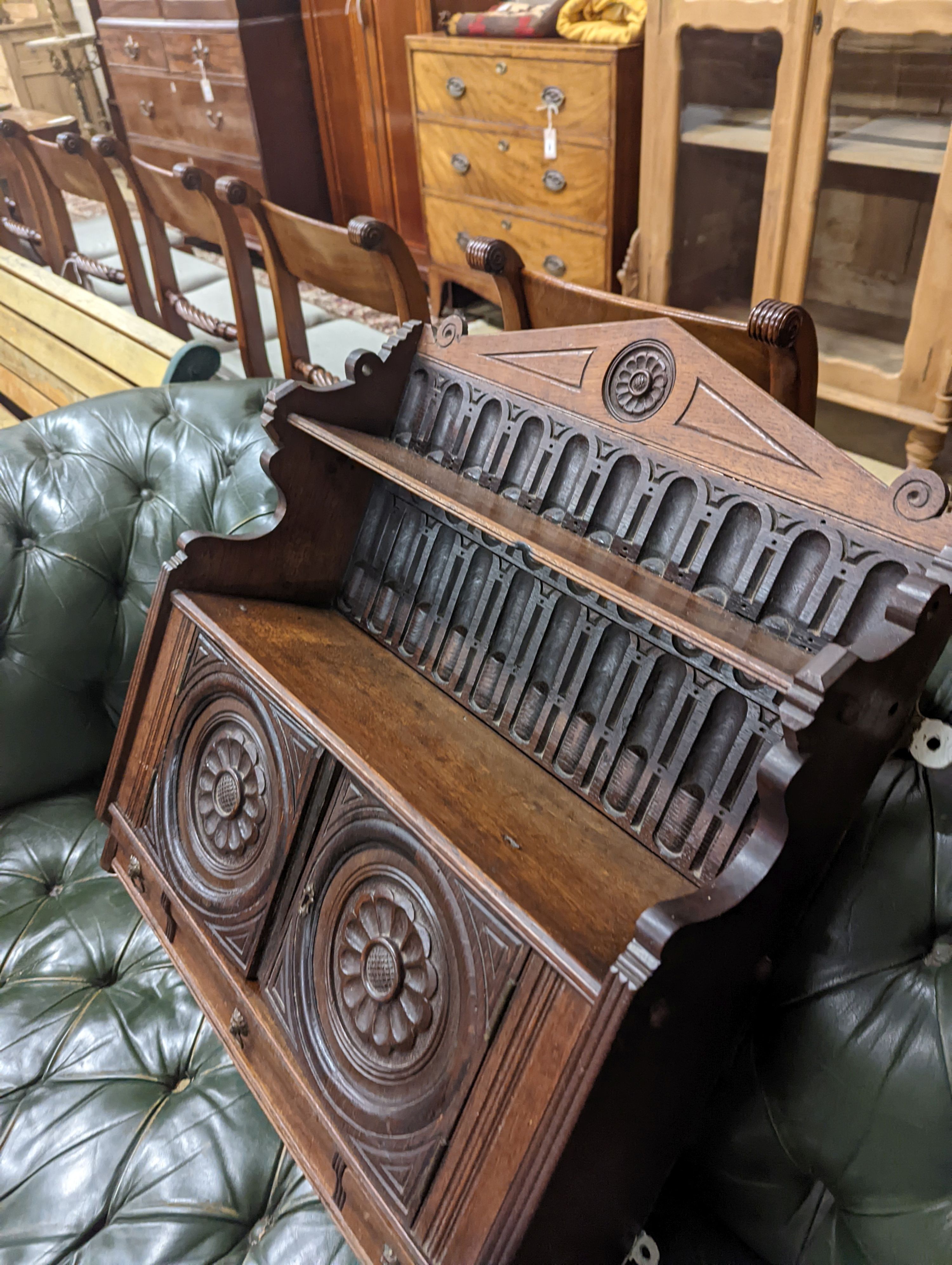 A Victorian carved oak Arts and Crafts wall cabinet, width 55cm, depth 18cm, height 68cm